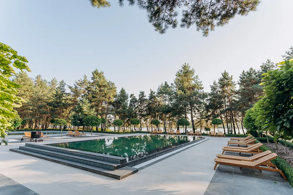Outdoor pool with sun loungers at Tykhyy Lis
